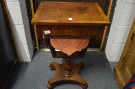 A Victorian walnut work table.