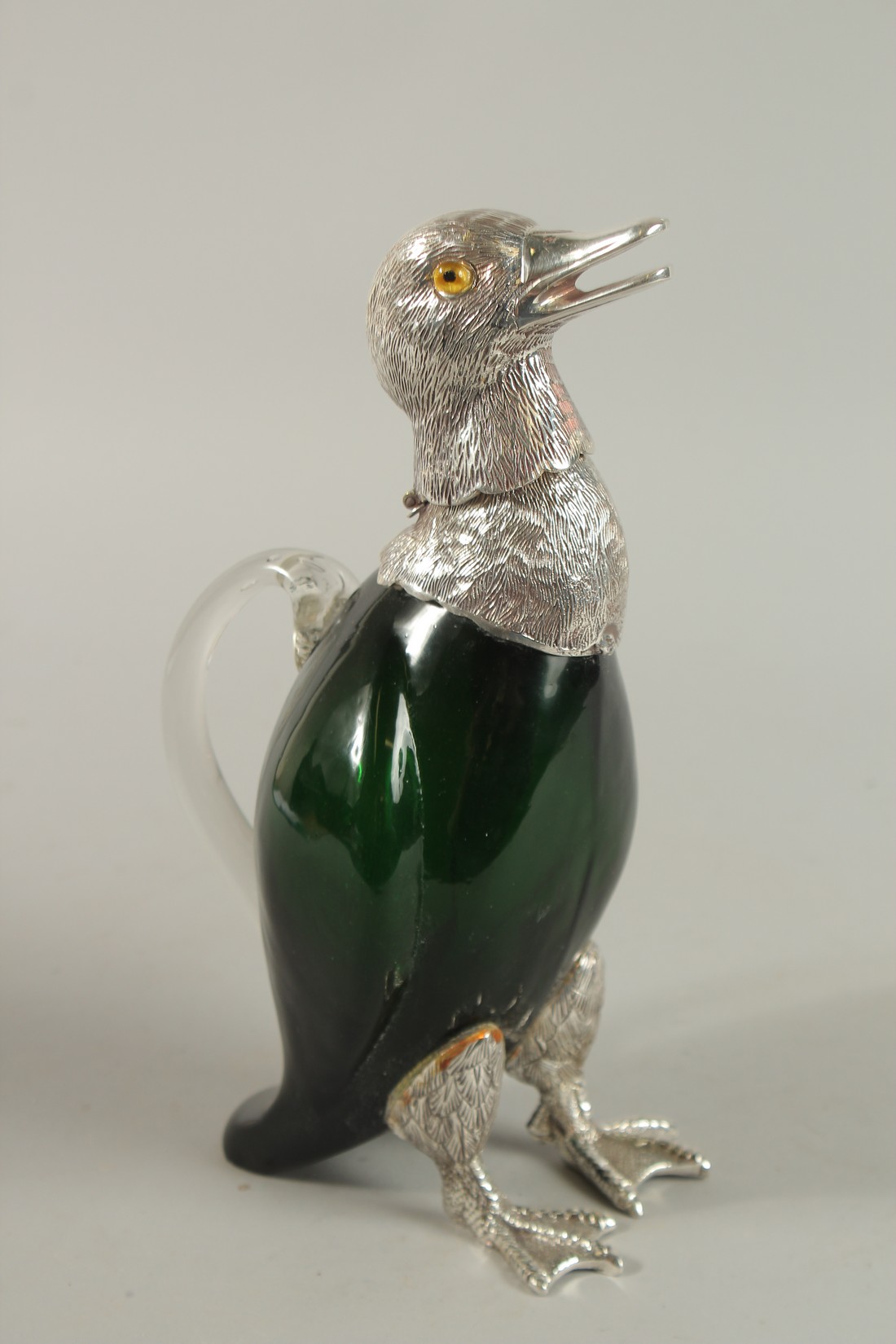 A GREEN COLOURED GLASS NOVELTY DUCK CLARET JUG with silver plated head and feet. 28cm high. - Image 2 of 3