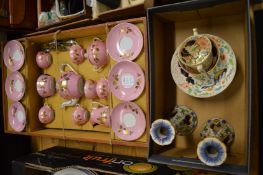 A child's porcelain tea service and other decorative china.