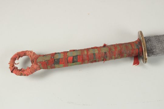 A FINE 19TH CENTURY CHINESE SWORD, with a wide engraved blade and fabric wrapped handle, 84cm long. - Image 13 of 13