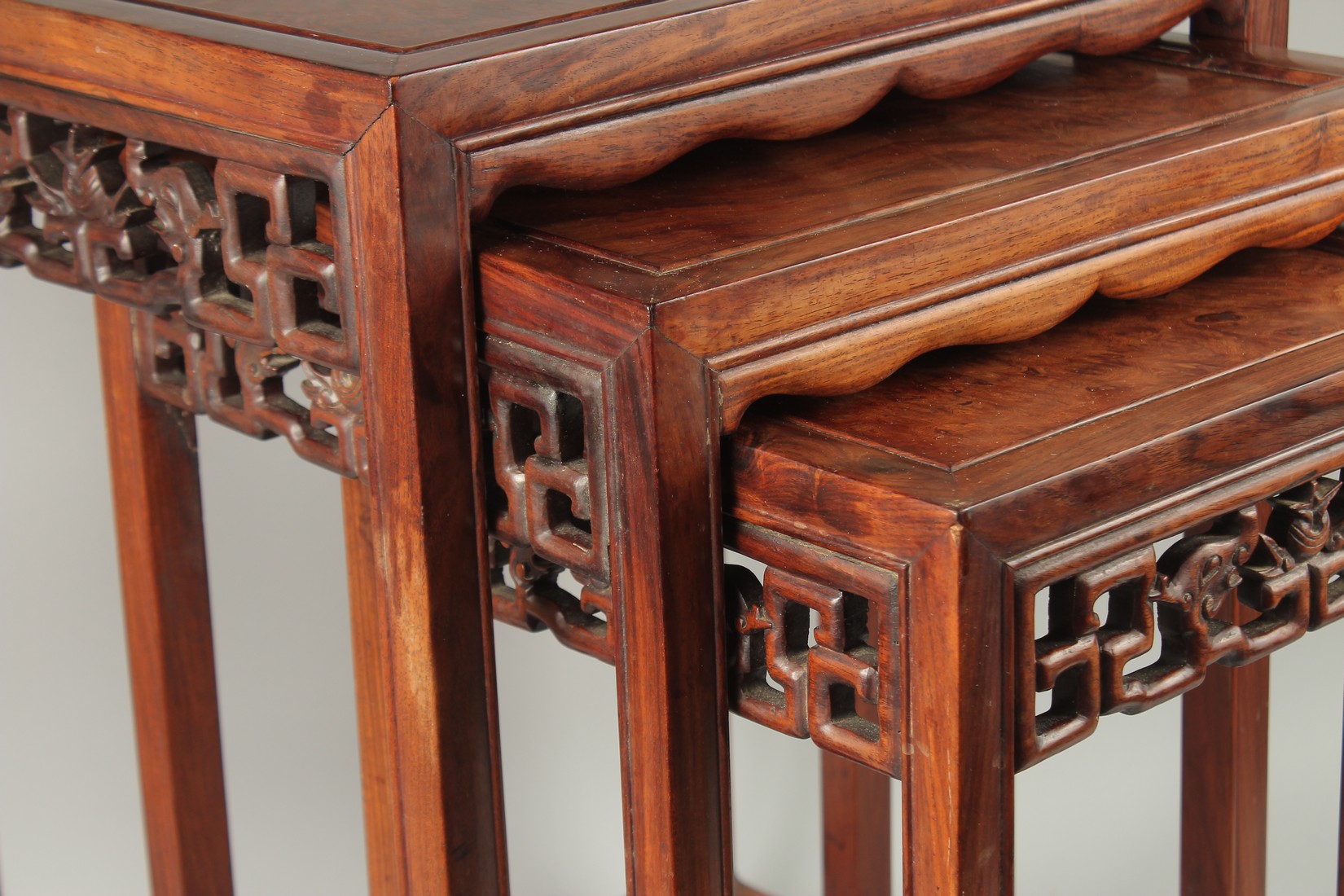 A CHINESE NEST OF THREE HARDWOOD TABLES, largest 59cm high, 43.5cm wide, 34.5cm deep. - Image 3 of 5