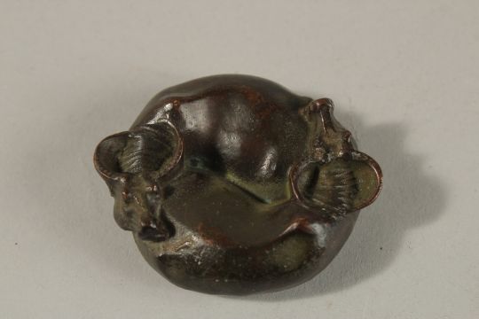 A BRONZE OKIMONO OF ENTWINED WATER BUFFALO, the reverse with yin yang symbol. - Image 1 of 2