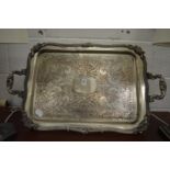 A large plated tray with engraved decoration.