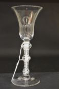 A GOOD GEORGIAN WINE GLASS with tapering inverted bowl and double knop air twist stem.