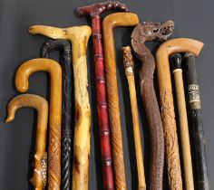 11 decorative walking sticks including carved