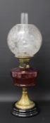 Brass paraffin lamp with cranberry glass reservoir & clear etched glass shade