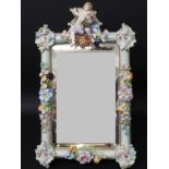 Thought to be Dresden China moulded frame strut mirror, with floral borders and putti (possible