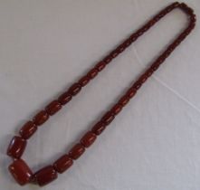 Graduated possibly amber bead necklace 116.6g, largest bead 3cm wide