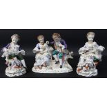 Sitzendorf porcelain figure group of a seated couple with lamb and two similar single figures, all