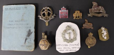 Selection of military badges, lighter & The Soldiers' English-French Conversation Book