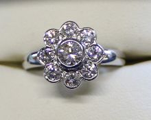 18ct white gold diamond daisy cluster ring, size N / O, 4.87g, set with total 1.30ct round brilliant