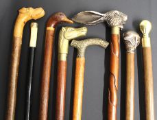 8 decorative walking sticks including one with internal test tube with stopper