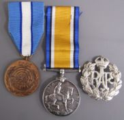 World War I medal 1019 PTE W.V Woodcock A.S.C, UN medal 'In the service of Peace' and an RAF badge