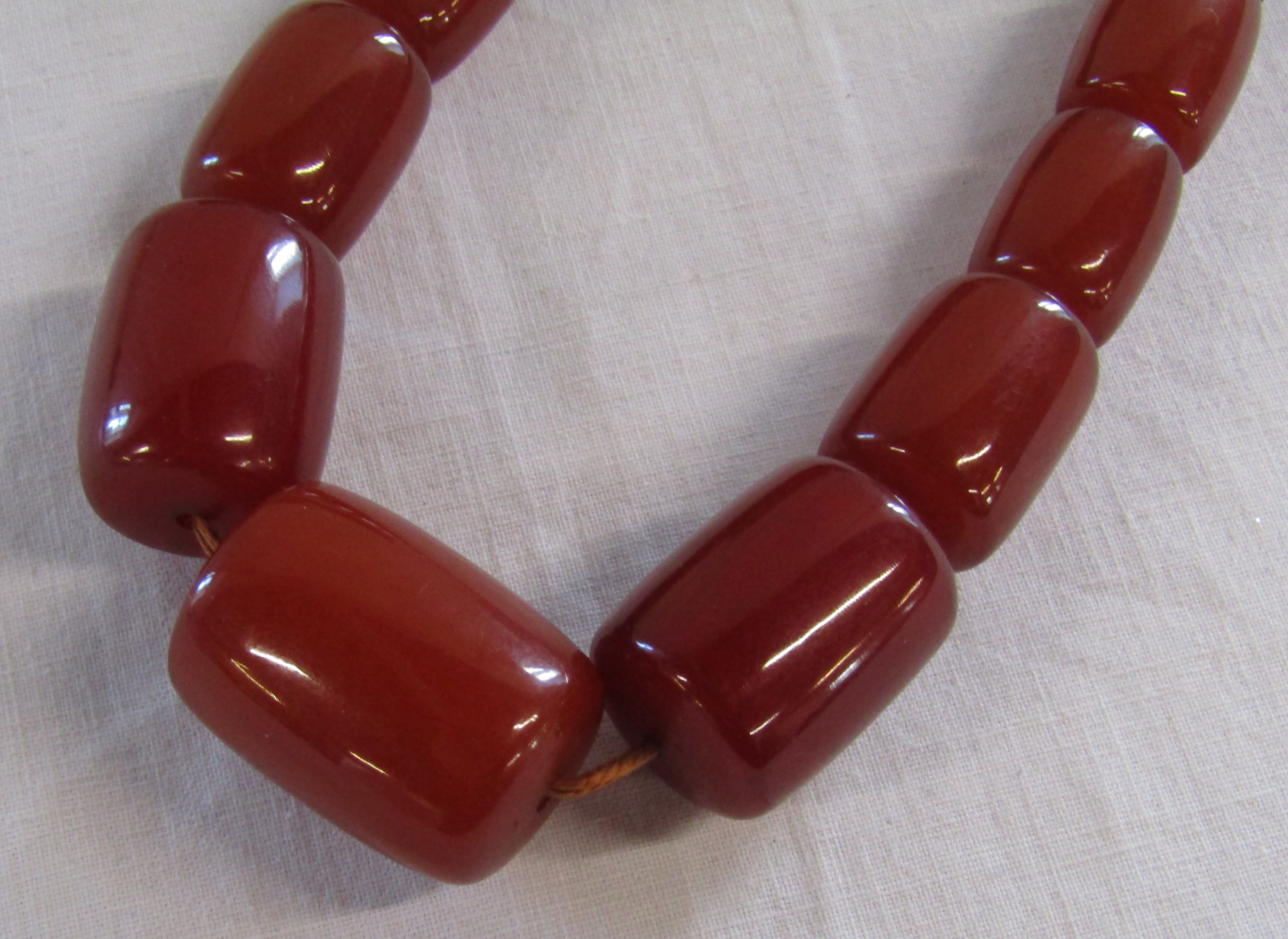 Graduated possibly amber bead necklace 116.6g, largest bead 3cm wide - Image 2 of 12
