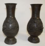 Pair of 19th century Oriental bronze flared rim vases with relief bird & prunus decoration, 30cm