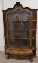 19th century Dutch walnut display cabinet on a bombe base with ball & hairy claw feet Ht 212cm W