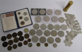 Collection of coins includes pennies, half penny, Churchill crowns, Coronation five shillings,