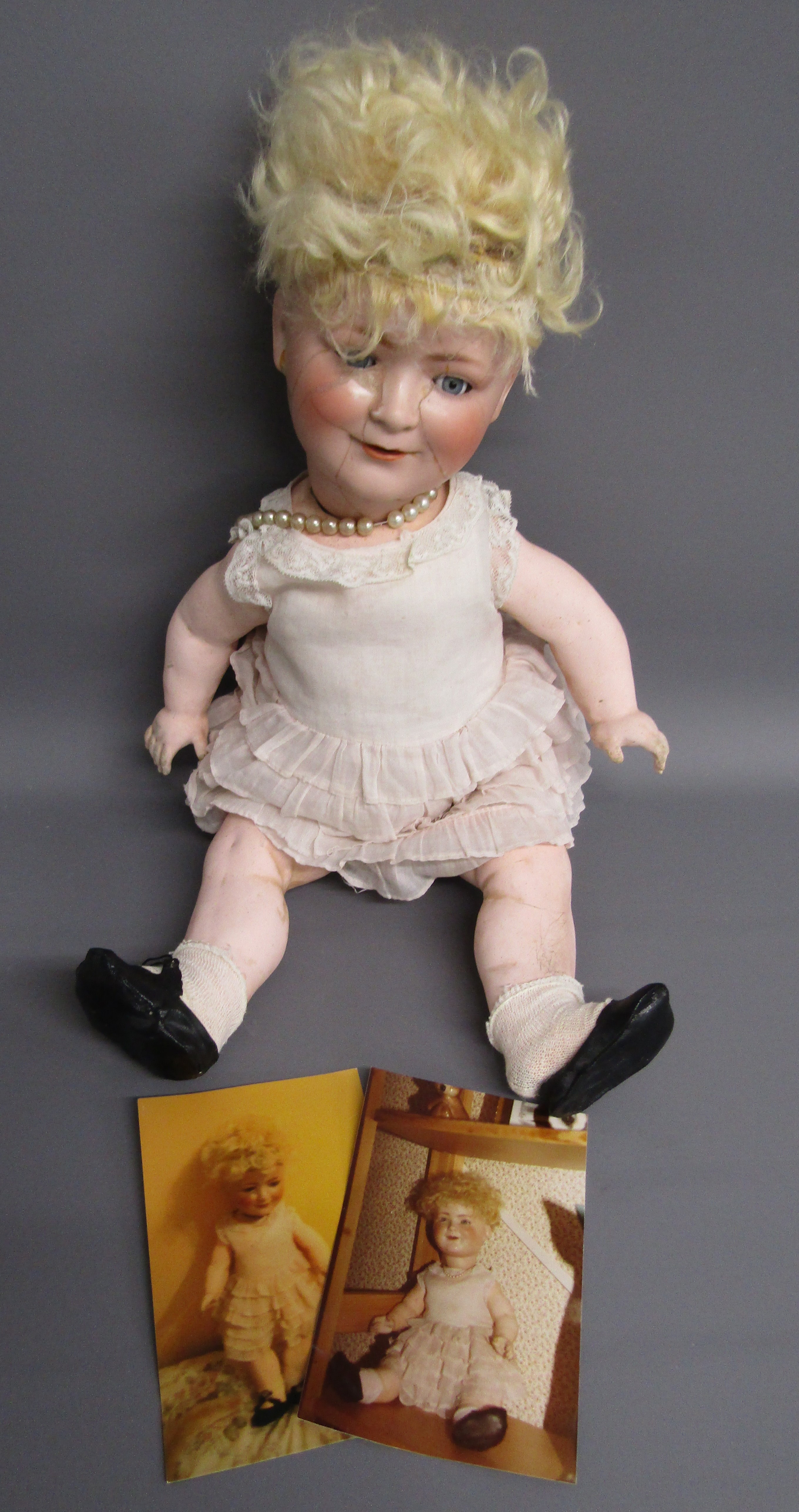 Schoenau and Hoffmeister bisque head 'Princess Elizabeth' doll with original frilly dress and