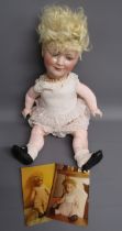Schoenau and Hoffmeister bisque head 'Princess Elizabeth' doll with original frilly dress and