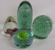 2 green glass dump paperweights & 2 others with flower design