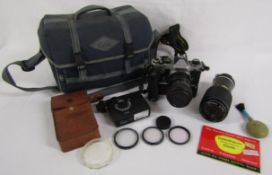 Nikon FE camera with MD-12 motor attached (af) with Tokina lens 28-70mm also has Nikon Nikkor 80-