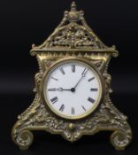 Ornate brass strut clock, impressed number 415, 20cm x 24cm, with key (appears to be working)