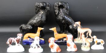 Pair of Jackfield spaniels & selection of 19th century dog figurines including recumbent