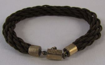 Plaited hair mourning bracelet with tested as 9ct gold mounts