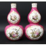 A pair of double gourd vases, 19th century, each decorated with scenes of courting couples on a puce