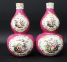 A pair of double gourd vases, 19th century, each decorated with scenes of courting couples on a puce