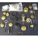 Selection of clock pendulums, keys etc.