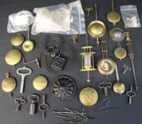 Selection of clock pendulums, keys etc.