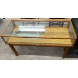 Mid 20th century low level display counter (missing doors) L 122cm W 53cm Ht 72cm