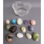 Crystal glass dish containing onyx eggs and one wooden egg