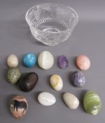 Crystal glass dish containing onyx eggs and one wooden egg