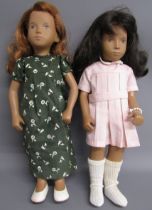 2 Sasha dolls - red hair blue eyes with green dress and black hair brown eyes with pink dress