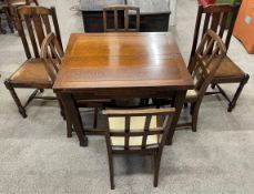 1930's fold out oak dining table with 4 chairs plus a pair of similar dining chairs