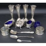 Selection of silver ware including 4 small vases, 2 napkin rings, condiment pair & one other & 3