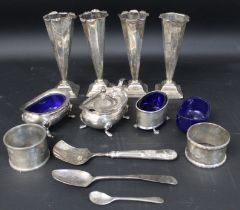 Selection of silver ware including 4 small vases, 2 napkin rings, condiment pair & one other & 3