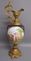Sevres ewer style jug - with painted panel depicting a couple and cupid and gilt metal base and