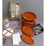 Large collection of Olympia cutlery, terracotta fish shaped dishes, varying sizes, wicker hamper and