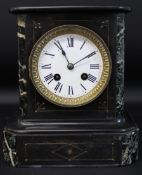 Small black slate mantel clock with marble inserts