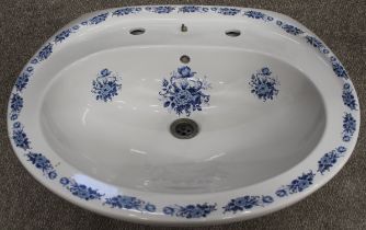 White pedestal wash basin with Victorian style blue printed decoration, the bowl with scalloped