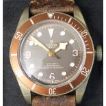 Gents Tudor Bay Heritage chronometer wristwatch with bronze and brown dial, leather strap, serial