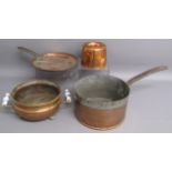 Large copper saucepan & lid, copper mould and twin handled copper footed pot