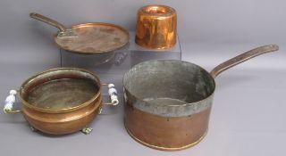 Large copper saucepan & lid, copper mould and twin handled copper footed pot