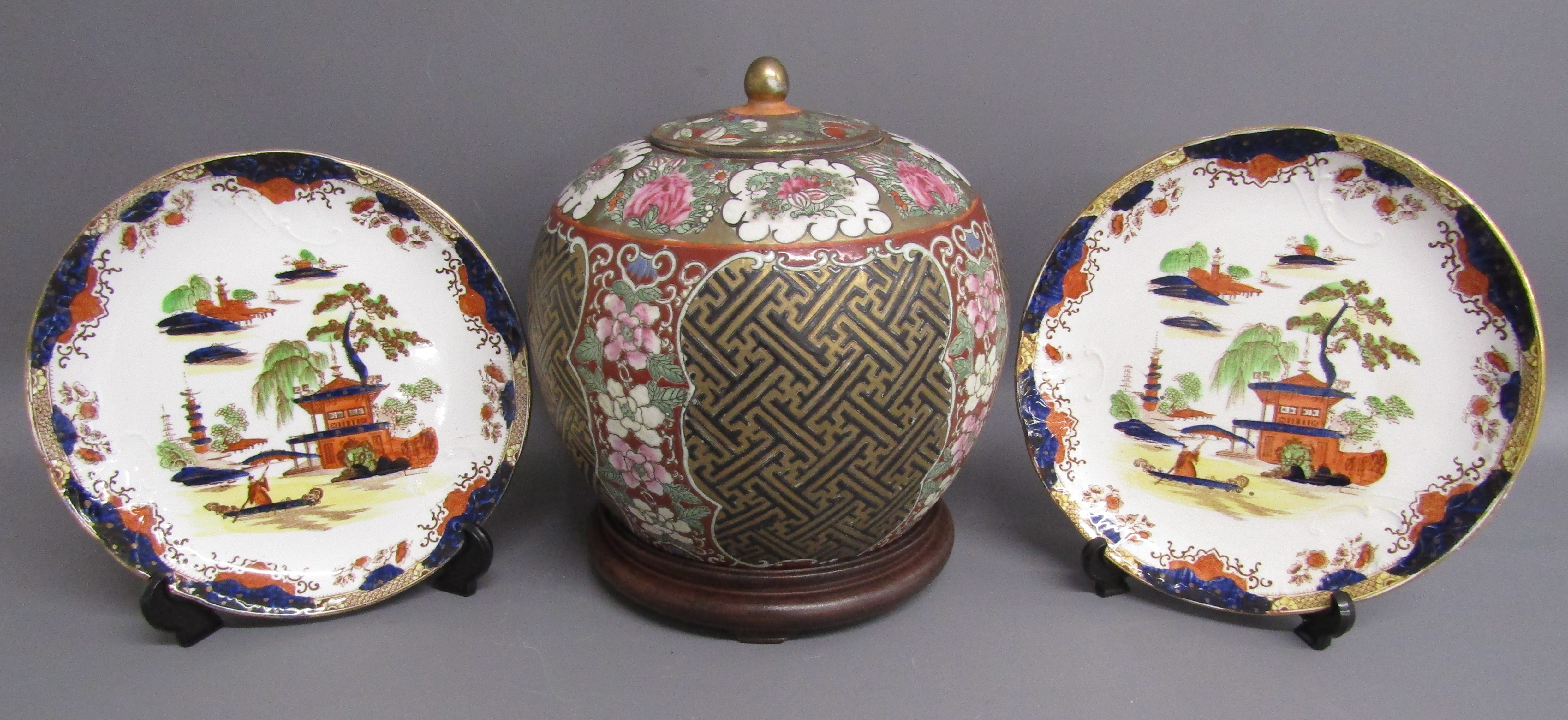 Chinese porcelain lidded pot with Qianlong mark and Made in Macau sticker on base placed on hardwood