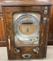 Early 20th century Allwin De Luxe penny in the slot machine.  Operates with both pennies & tokens (