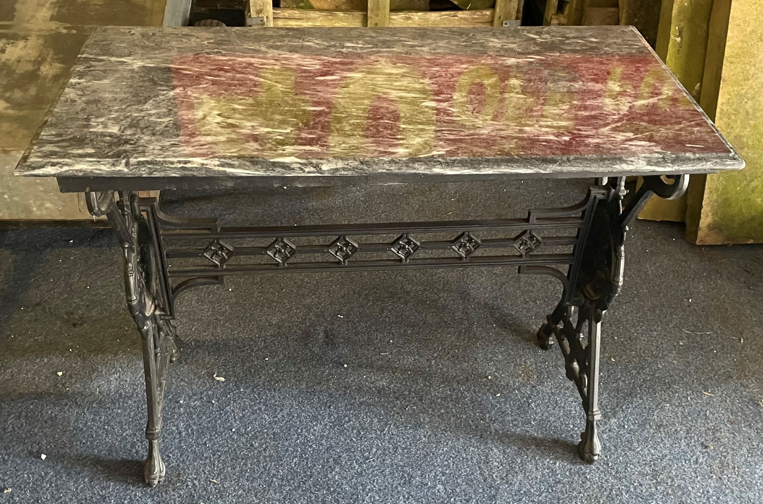 Early 20th century cast iron pub table with marble top & cast with a portrait of Edward VI Top