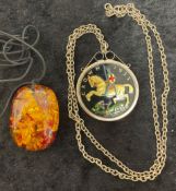 Enameled five shilling piece pendant on a chain & an amber type pendant